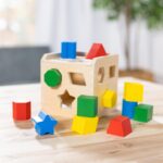 Melissa & Doug Shape Sorting Cube - Classic Wooden Toy With 12 Shapes - Image 10
